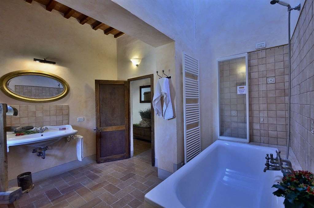 A view of the first floor bathroom doorway taken from the head of the bathtub.